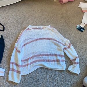 white and pink holey sweater